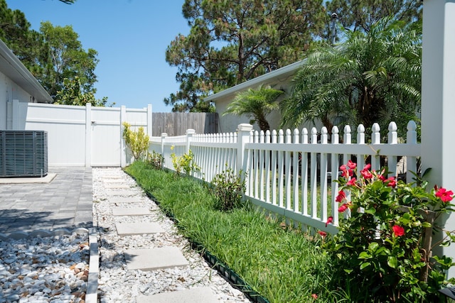 2471 SE Leithgow St, Port Saint Lucie, FL 34952 - view of yard featuring central air condition unit