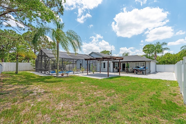 2471 SE Leithgow St, Port Saint Lucie, FL 34952 - back of property featuring a patio area and glass enclosure