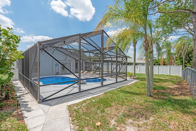 2471 SE Leithgow St, Port Saint Lucie, FL 34952 - view of swimming pool with a patio area and glass enclosure