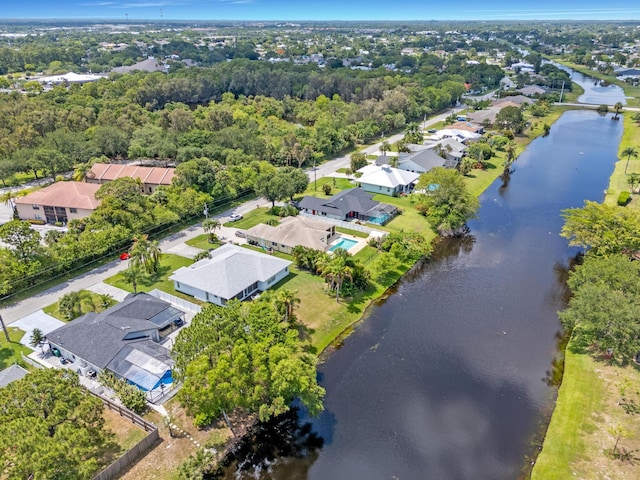 2471 SE Leithgow St, Port Saint Lucie, FL 34952 - aerial view of property and surrounding area with a large body of water and nearby suburban area