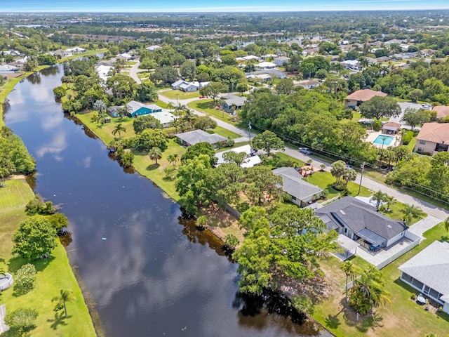 2471 SE Leithgow St, Port Saint Lucie, FL 34952 - aerial view of property and surrounding area featuring a nearby body of water and nearby suburban area