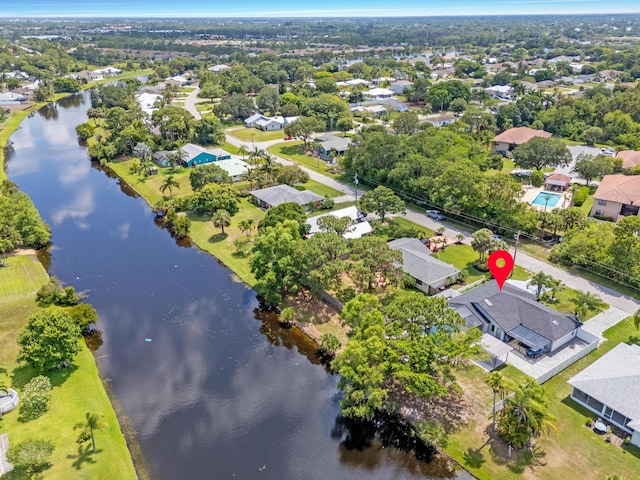 2471 SE Leithgow St, Port Saint Lucie, FL 34952 - aerial view of property's location with a nearby body of water and nearby suburban area