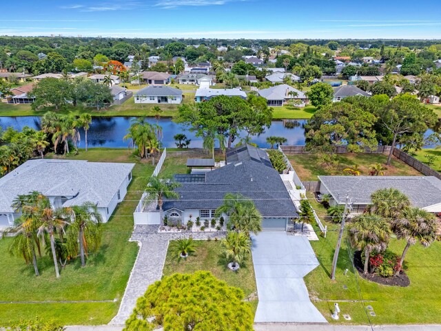 2471 SE Leithgow St, Port Saint Lucie, FL 34952 - aerial view of residential area featuring a nearby body of water