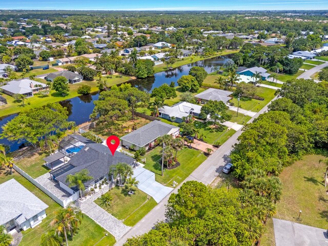 2471 SE Leithgow St, Port Saint Lucie, FL 34952 - aerial view of property and surrounding area featuring nearby suburban area and a nearby body of water