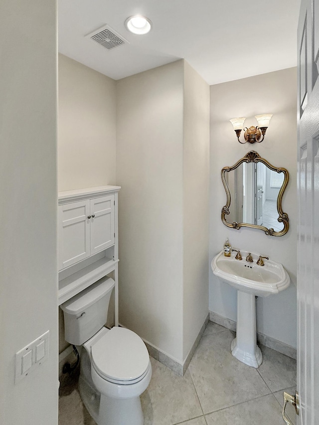 7725 Royale River Ln, Lake Worth, FL 33467 - bathroom with toilet, tile patterned floors, and baseboards