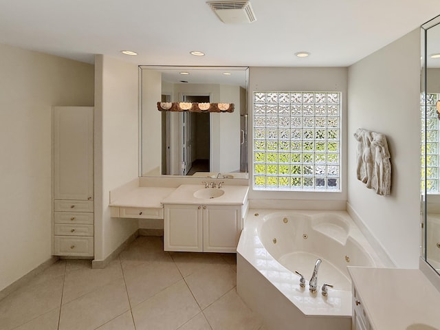 7725 Royale River Ln, Lake Worth, FL 33467 - bathroom featuring a tub with jets, vanity, plenty of natural light, tile patterned floors, and recessed lighting