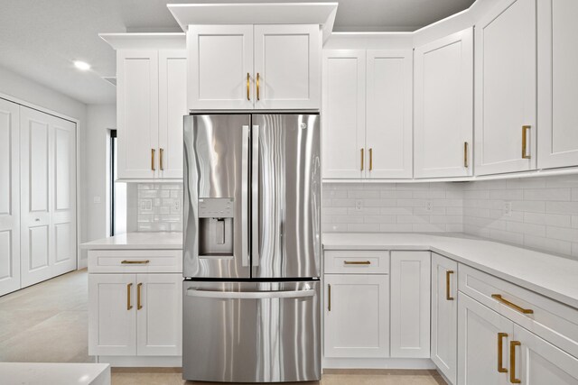 13590 82nd St N, Loxahatchee, FL 33470 - kitchen featuring stainless steel refrigerator with ice dispenser, tasteful backsplash, light countertops, white cabinetry, and recessed lighting