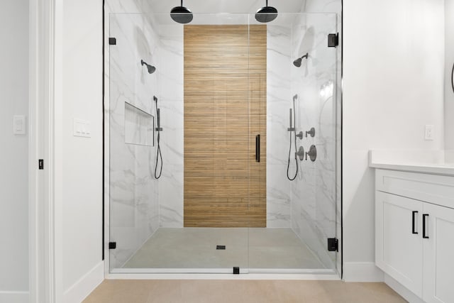 13590 82nd St N, Loxahatchee, FL 33470 - full bathroom with a marble finish shower, vanity, and baseboards