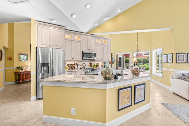 5986 Vista Linda Ln, Boca Raton, FL 33433 - kitchen featuring stainless steel appliances, a large island, light tile patterned floors, light stone counters, and glass insert cabinets