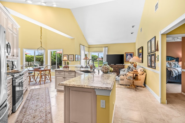5986 Vista Linda Ln, Boca Raton, FL 33433 - kitchen featuring stainless steel electric range oven, high vaulted ceiling, a sink, light tile patterned flooring, and light stone countertops