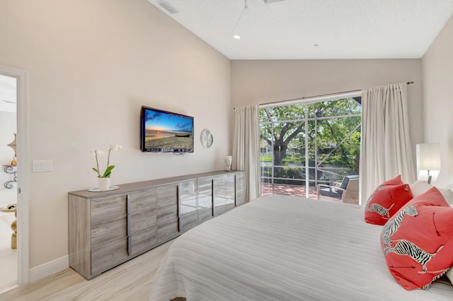6690 Remington Pl, Lake Worth, FL 33463 - bedroom with access to exterior, wood finished floors, baseboards, and high vaulted ceiling