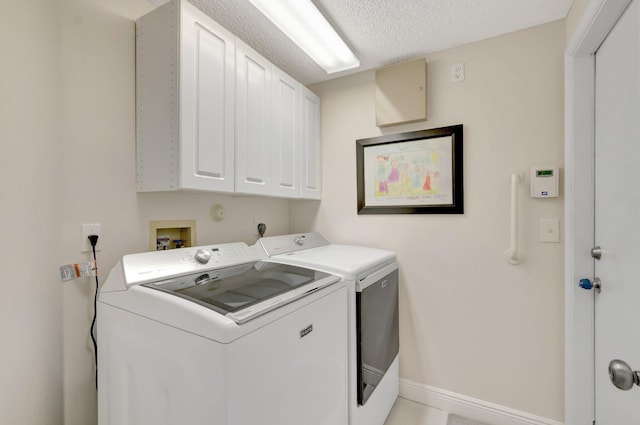 6690 Remington Pl, Lake Worth, FL 33463 - washroom featuring cabinet space, separate washer and dryer, baseboards, and a textured ceiling