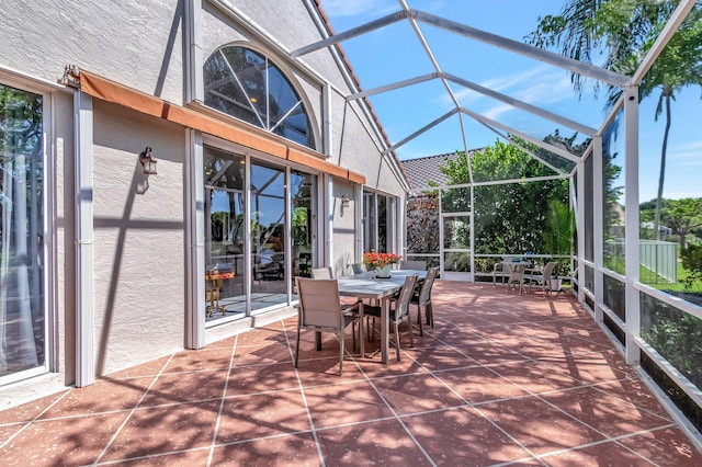 6690 Remington Pl, Lake Worth, FL 33463 - view of patio featuring outdoor dining space and glass enclosure