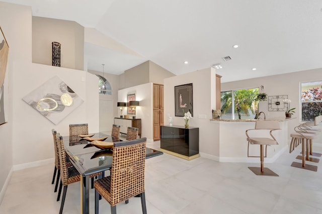 6690 Remington Pl, Lake Worth, FL 33463 - dining area featuring baseboards, vaulted ceiling, and recessed lighting