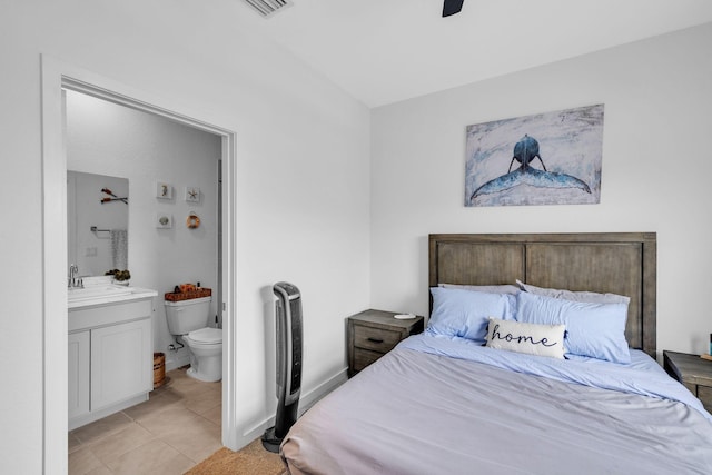 460 Ne 4th Lane End Unit E Of Us1And Tp, Florida City, FL 33034 - bedroom featuring a sink, light tile patterned floors, connected bathroom, and a ceiling fan