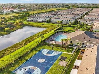 460 Ne 4th Lane End Unit E Of Us1And Tp, Florida City, FL 33034 - drone / aerial view of a pool area and a large body of water