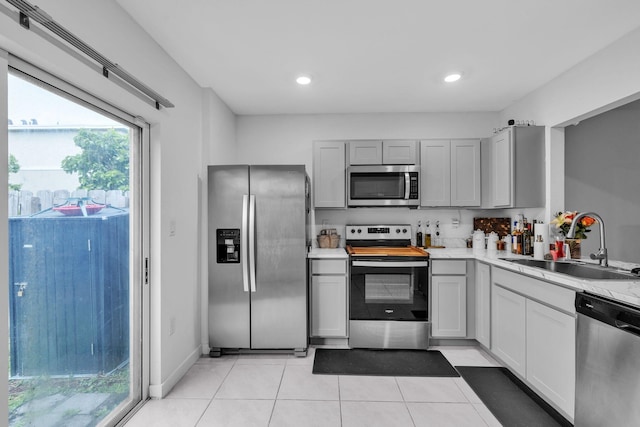 460 Ne 4th Lane End Unit E Of Us1And Tp, Florida City, FL 33034 - kitchen featuring appliances with stainless steel finishes, a sink, light tile patterned floors, gray cabinetry, and recessed lighting