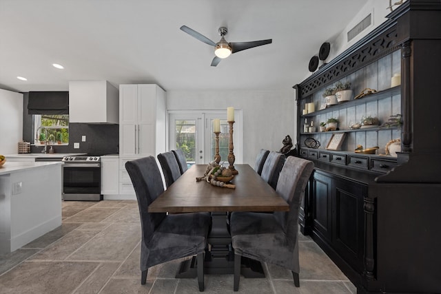 14244 Horseshoe Trce, Wellington, FL 33414 - dining area with a ceiling fan, stone tile floors, and recessed lighting