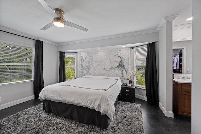 14244 Horseshoe Trce, Wellington, FL 33414 - bedroom with ornamental molding, baseboards, finished concrete floors, a ceiling fan, and a sink