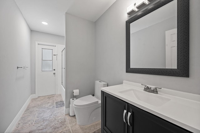 14244 Horseshoe Trce, Wellington, FL 33414 - full bathroom featuring vanity, toilet, enclosed tub / shower combo, and baseboards
