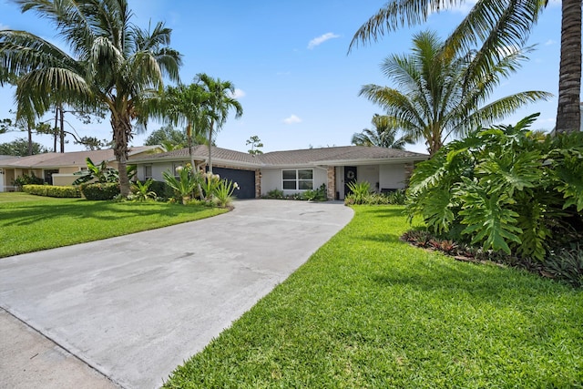 14244 Horseshoe Trce, Wellington, FL 33414 - single story home featuring an attached garage, driveway, a front yard, and stucco siding