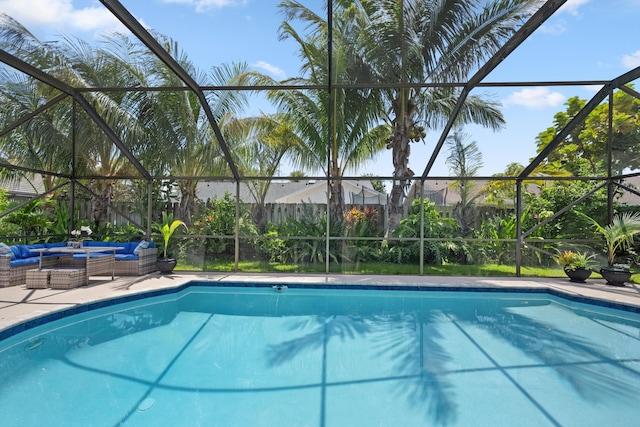 14244 Horseshoe Trce, Wellington, FL 33414 - swimming pool featuring a lanai, an outdoor hangout area, and a patio