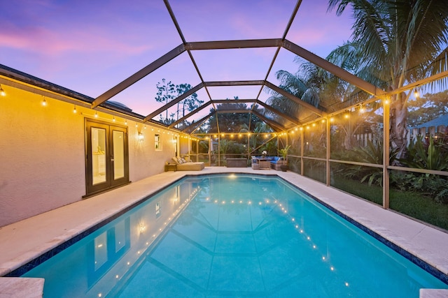14244 Horseshoe Trce, Wellington, FL 33414 - outdoor pool with a patio area, glass enclosure, and french doors