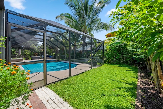 14244 Horseshoe Trce, Wellington, FL 33414 - swimming pool featuring a yard, glass enclosure, and a patio