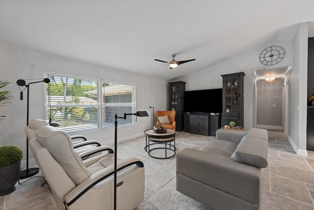 14244 Horseshoe Trce, Wellington, FL 33414 - living room with ceiling fan, vaulted ceiling, baseboards, and stone tile floors