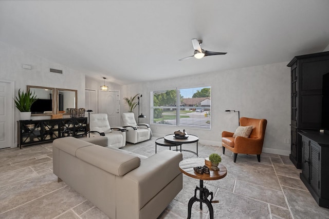 14244 Horseshoe Trce, Wellington, FL 33414 - living room with a ceiling fan, light stone finish flooring, vaulted ceiling, and baseboards
