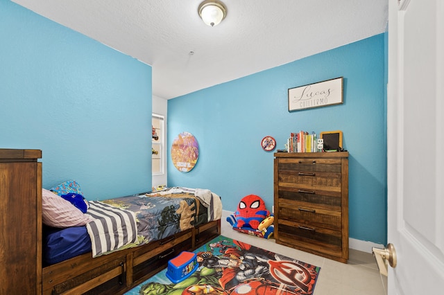 899 Pipers Cay Dr, West Palm Beach, FL 33415 - tiled bedroom with baseboards