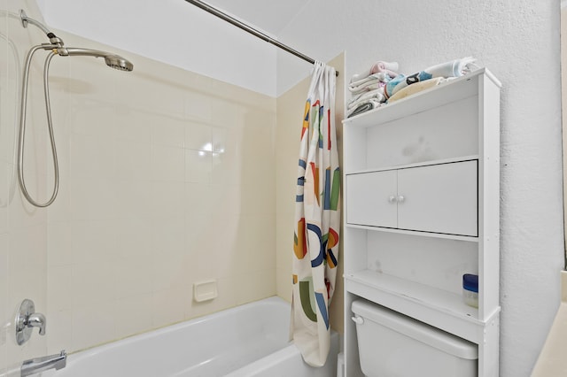 899 Pipers Cay Dr, West Palm Beach, FL 33415 - full bathroom featuring shower / bathtub combination with curtain, toilet, and a textured wall