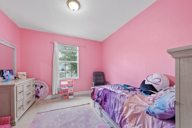 899 Pipers Cay Dr, West Palm Beach, FL 33415 - bedroom with light tile patterned flooring and baseboards