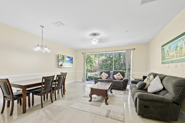 899 Pipers Cay Dr, West Palm Beach, FL 33415 - living area featuring a chandelier and light tile patterned flooring