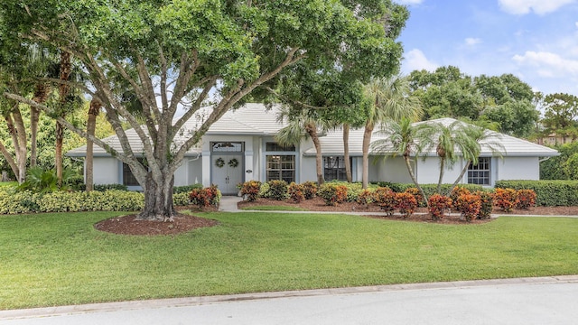 756 SW Pelican Cv, Port Saint Lucie, FL 34986 - view of front of home with stucco siding and a front lawn