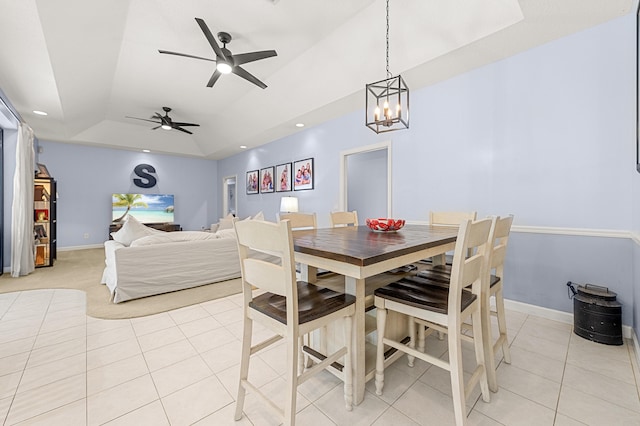 756 SW Pelican Cv, Port Saint Lucie, FL 34986 - dining area featuring light tile patterned floors, a raised ceiling, baseboards, and a chandelier