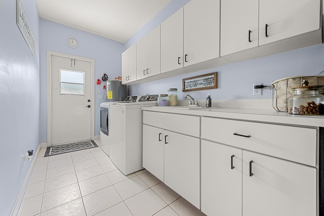 756 SW Pelican Cv, Port Saint Lucie, FL 34986 - laundry area with separate washer and dryer, cabinet space, electric water heater, light tile patterned floors, and baseboards