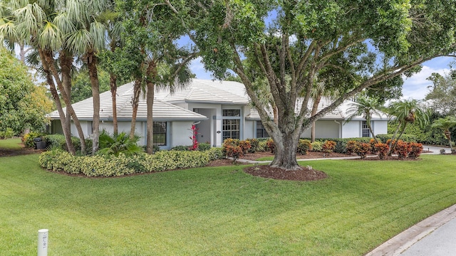 756 SW Pelican Cv, Port Saint Lucie, FL 34986 - view of front facade with stucco siding and a front yard