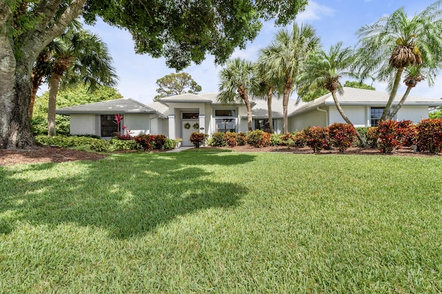 756 SW Pelican Cv, Port Saint Lucie, FL 34986 - view of front of property with a front lawn and stucco siding