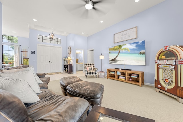 756 SW Pelican Cv, Port Saint Lucie, FL 34986 - carpeted living room featuring a ceiling fan, a high ceiling, baseboards, and recessed lighting