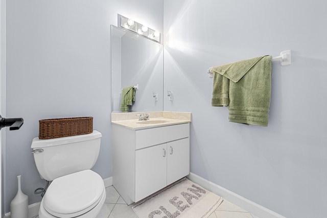 756 SW Pelican Cv, Port Saint Lucie, FL 34986 - half bathroom featuring vanity, toilet, tile patterned floors, and baseboards