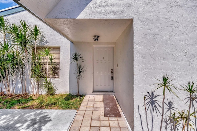 82 Baytree Cir, Boynton Beach, FL 33436 - view of exterior entry featuring stucco siding