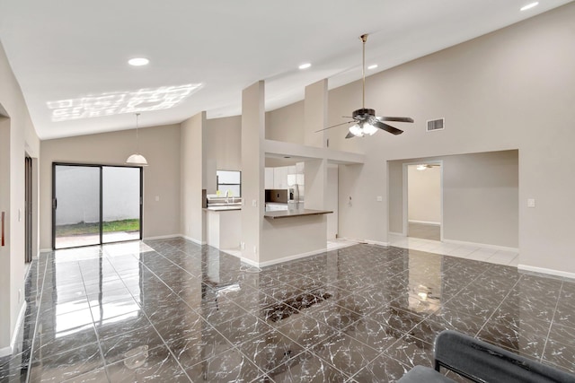 82 Baytree Cir, Boynton Beach, FL 33436 - unfurnished living room with marble tiled flooring, recessed lighting, ceiling fan, baseboards, and high vaulted ceiling