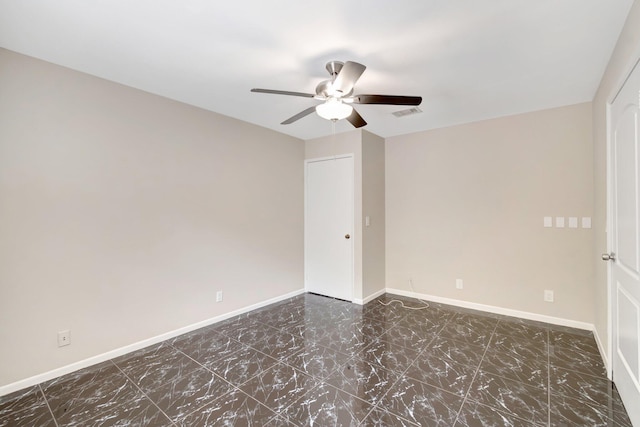 82 Baytree Cir, Boynton Beach, FL 33436 - spare room featuring a ceiling fan, baseboards, and marble finish floors