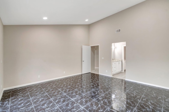 82 Baytree Cir, Boynton Beach, FL 33436 - unfurnished room featuring baseboards, a towering ceiling, recessed lighting, and marble finish flooring