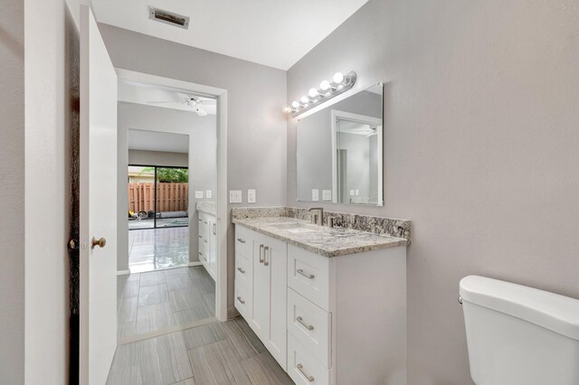 82 Baytree Cir, Boynton Beach, FL 33436 - bathroom featuring toilet, vanity, and baseboards