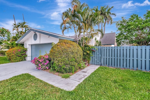 82 Baytree Cir, Boynton Beach, FL 33436 - view of property exterior featuring stucco siding, an attached garage, and driveway