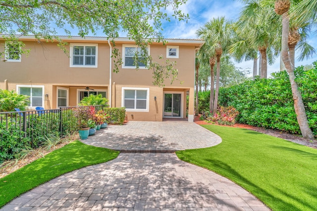 5030 Dulce Ct, Palm Beach Gardens, FL 33418 - rear view of property featuring stucco siding, ceiling fan, and a patio