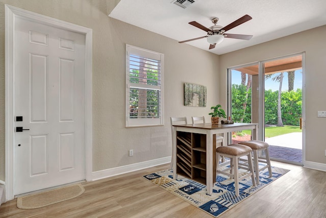 5030 Dulce Ct, Palm Beach Gardens, FL 33418 - dining area with wood finished floors, baseboards, and ceiling fan