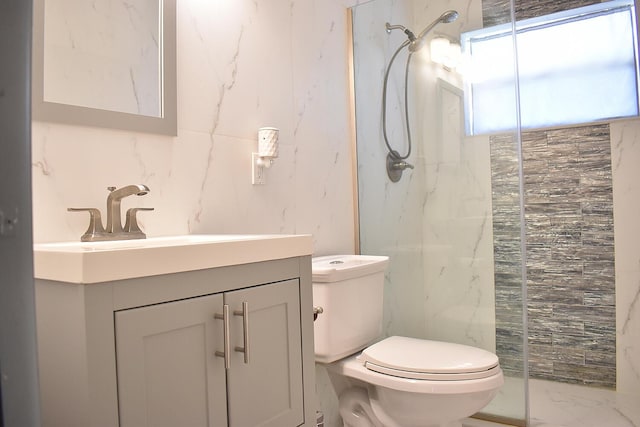 2597 Emory Dr W Unit G, West Palm Beach, FL 33415 - full bathroom featuring a marble finish shower, toilet, tile walls, vanity, and marble finish floors